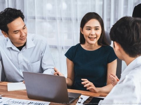 professional-asian-employee-work-together-as-team-corporate-office-discussing-business-plans-data-achieve-success-desk-with-laptop-modern-office-worker-teamwork-concept-concord